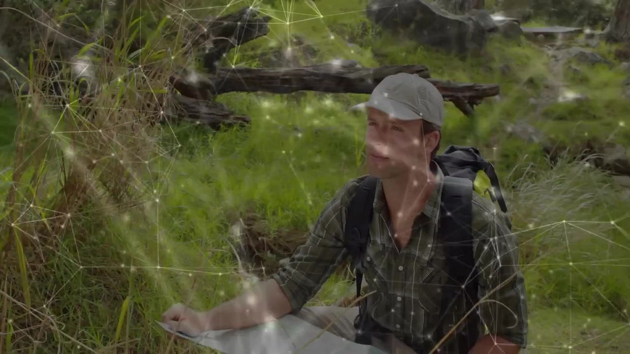 Happy Man Consulting Map in Forest with Digital Network Overlay