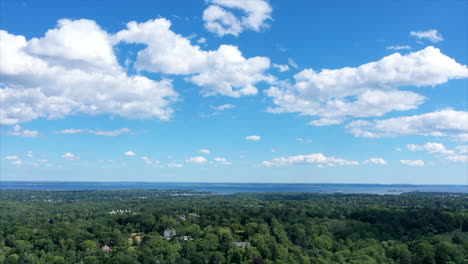 time lapse of early afternoon clouds in greenwich, connecticut with the long island sound in the background