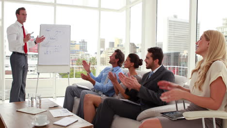 Business-team-listening-to-presentation