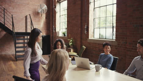 steadicam shot in of diverse business team meeting