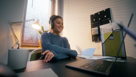 woman working on laptop in a home office