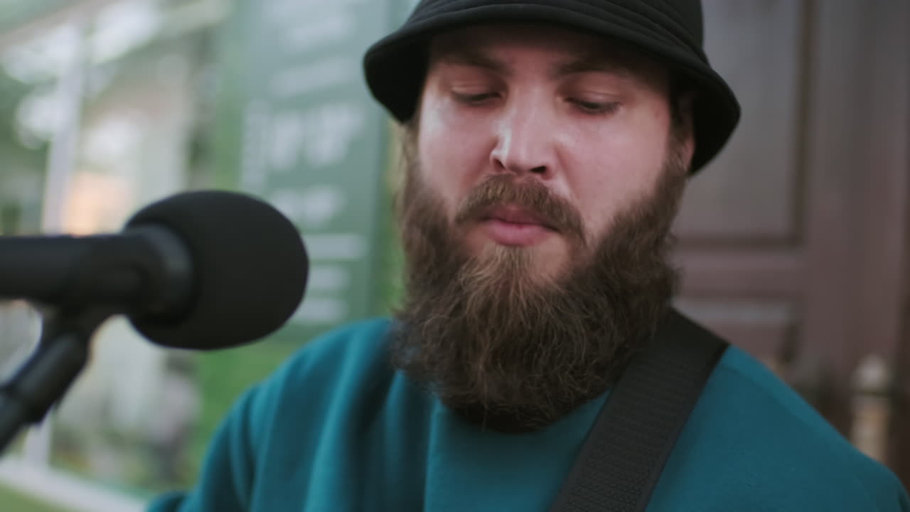 Bearded Male Musician Performing Song