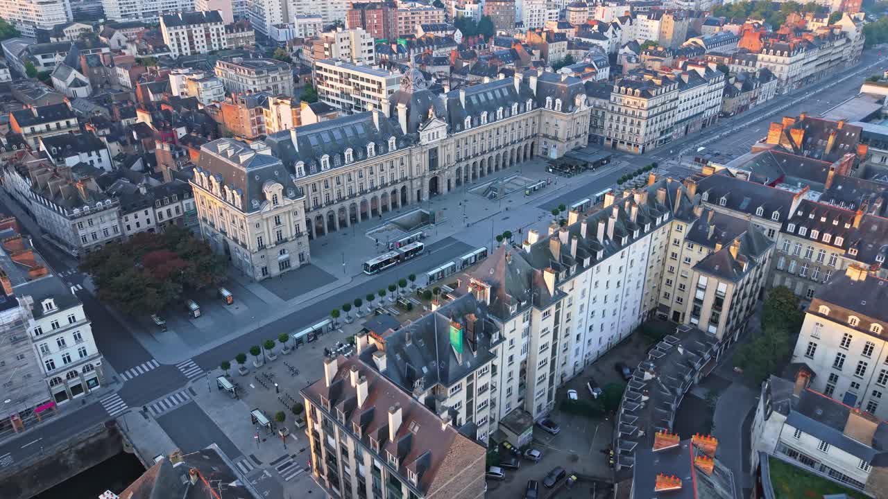 Approaching drone fly to Palais du Commerce former stock exchange building and offices and shops nowadays with Place de la République square, Rennes, Ille-et-Vilaine, France