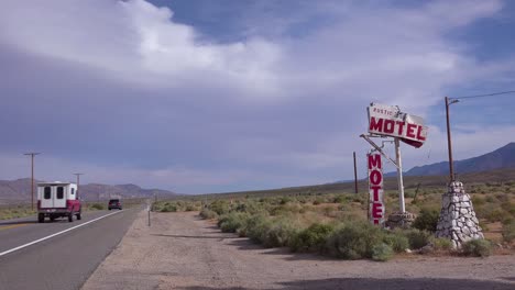 An-abandoned-or-rundown-old-rustic-motel-along-a-rural-road-in-America