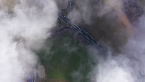 above clouds fields and road highway in france auvergne