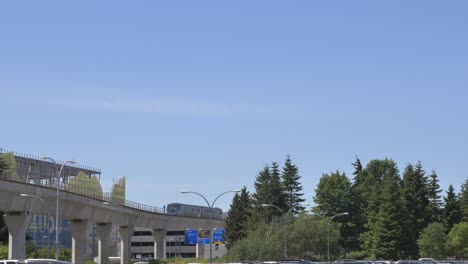 metro arriving yvr airport station, pan to air traffic control tower