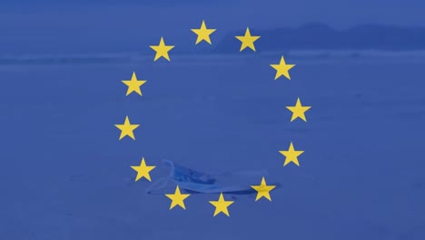 Animation-of-flag-of-eu-over-waste-on-beach