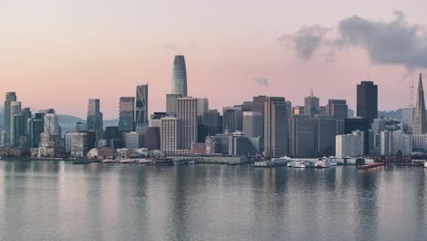 aerial of san francisco financial district with golden sky at sunrise