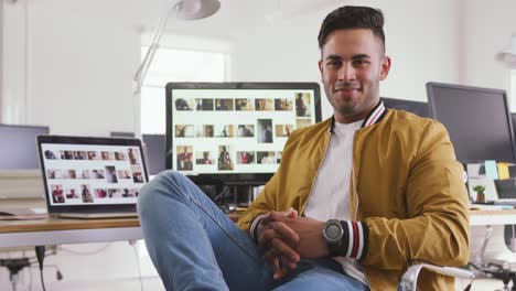 Front-view-of-mixed-race-man-in-creative-office