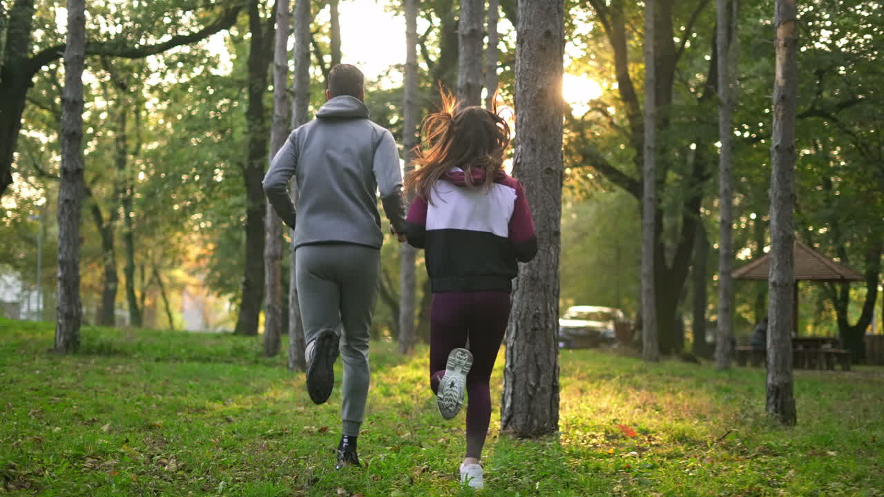 Couple jogging in a forest