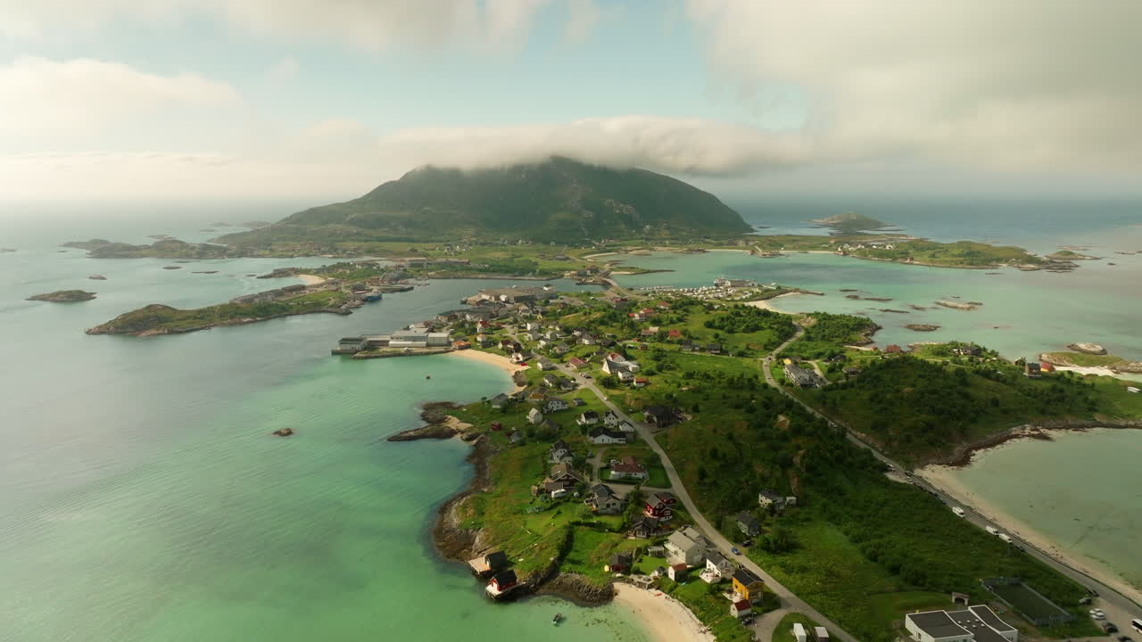 Aerial View of a Coastal Village with Mountains