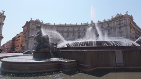 fountain of the naiads in the center of "piazza della repubblica" in rome.  at the center is glaucus, a greek prophetic sea-god. orbital move. north east part of porticos in the background.