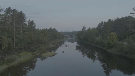 aerial view over piscataquis-river on a calm evening