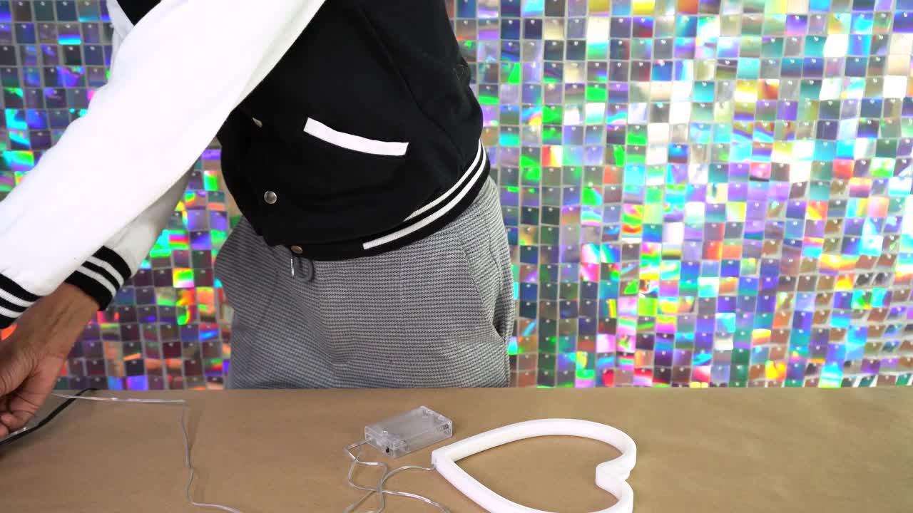 Plugging in pink heart shaped lamp, romantic light