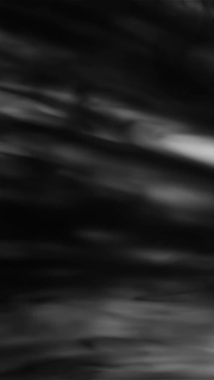 Sfondo astratto in movimento con liquido bianco e nero che scorre