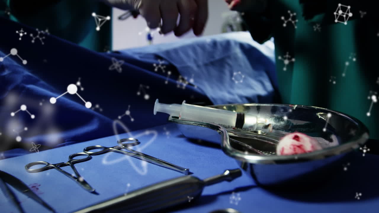 수술 중에 백인 외과 의사의 손 위에 분자의 애니메이션