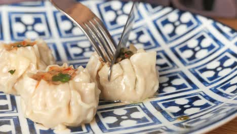 fork and knife eating dim sum