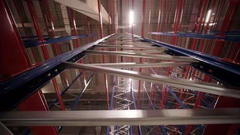 big and modern warehouse under construction, featuring metal shelving and other industrial equipment.