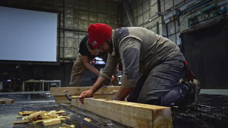 construction crew assembling wooden structure