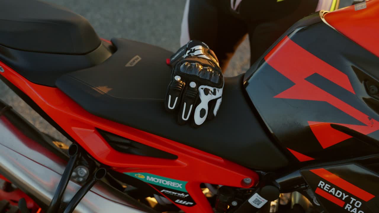 Motorcyclist on a Red Sportbike at Sunset