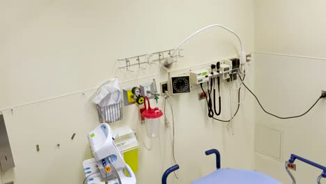 Slow-pan-down-of-medical-equipment-on-the-back-wall-of-an-emergency-room