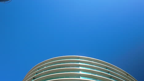 modern architecture in gibraltar with curved design against a clear blue sky