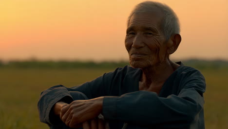 portrait of an elderly man at sunset