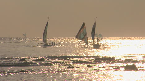 Sailboats-Coast-Across-A-Shimmering-Sea