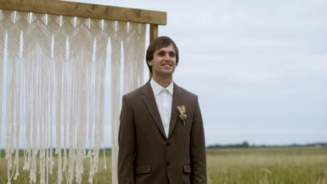 groom in an autumn field