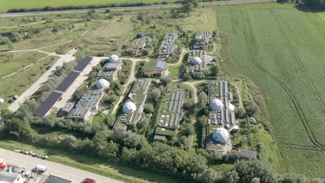 high-jib-down-of-beautiful-green-earthship-village