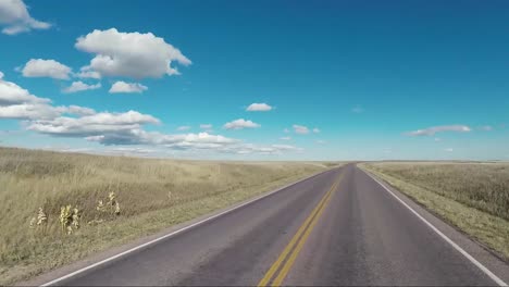 traveling on the open road through the plains of the midwest on a beautiful sunny day