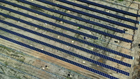 drone rotate above off the grid solar energy panels farm aerial countryside view