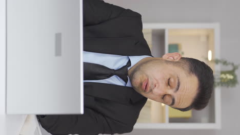 vertical video of home office worker man taking a break from his work.