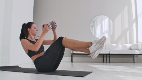 Profile-side-view-photo-portrait-of-charming-gorgeous-sporty-sportive-concentrated-beautiful-with-ponytail-brunette-lady-doing-crunches-on-purple-carpet-at-the-weekend-leading-healthy-lifestyle