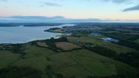 Rural-Water-Aerial-Drone-Landscape-at-Chonchi,-Chiloe,-Lemuy-Island-Water-Sky,-reflection-of-delta-houses-and-rural-villages,-travel-destination-at-Patagonia-south-america