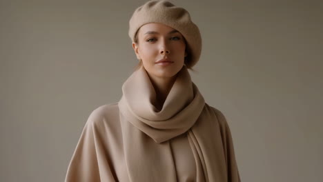 elegant woman in beige beret and scarf