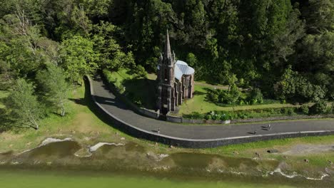 Chapel-Of-Nossa-Senhora-das-Vitórias-And-Furnas-Lake-In-Portugal---aerial-shot