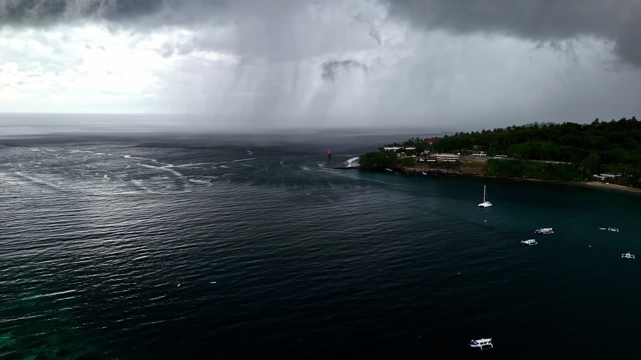 Storm gray clouds Bali island Senggigi Beach Indonesia coastline incoming bad weather
