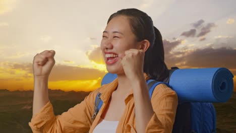 Happy Woman on a Hiking Trip at Sunrise
