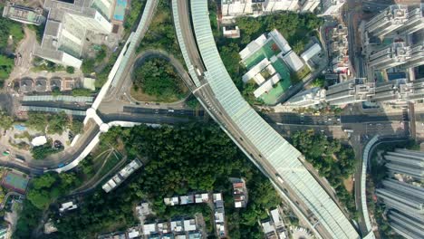 Downtown-Hong-Kong-city-skyscrapers-and-urban-traffic,-Aerial-view