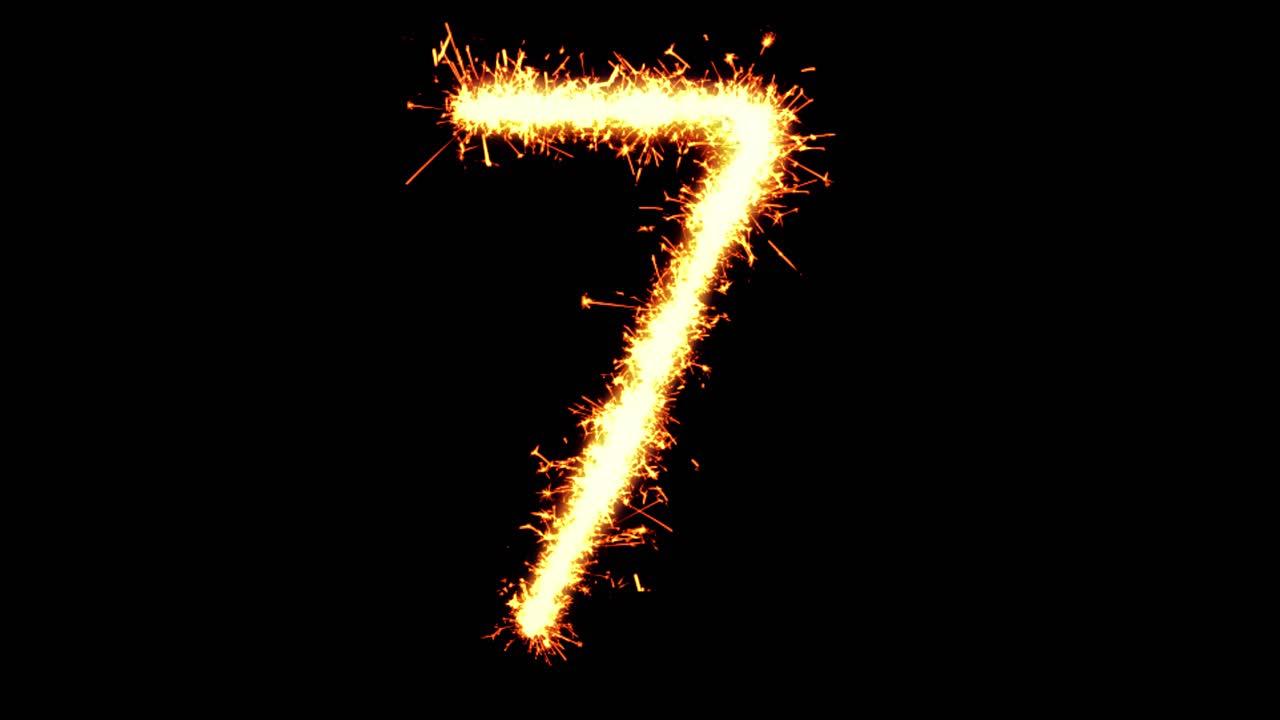 Number 7 text sparkler writing with glitter sparks particles firework on black 4k loop background