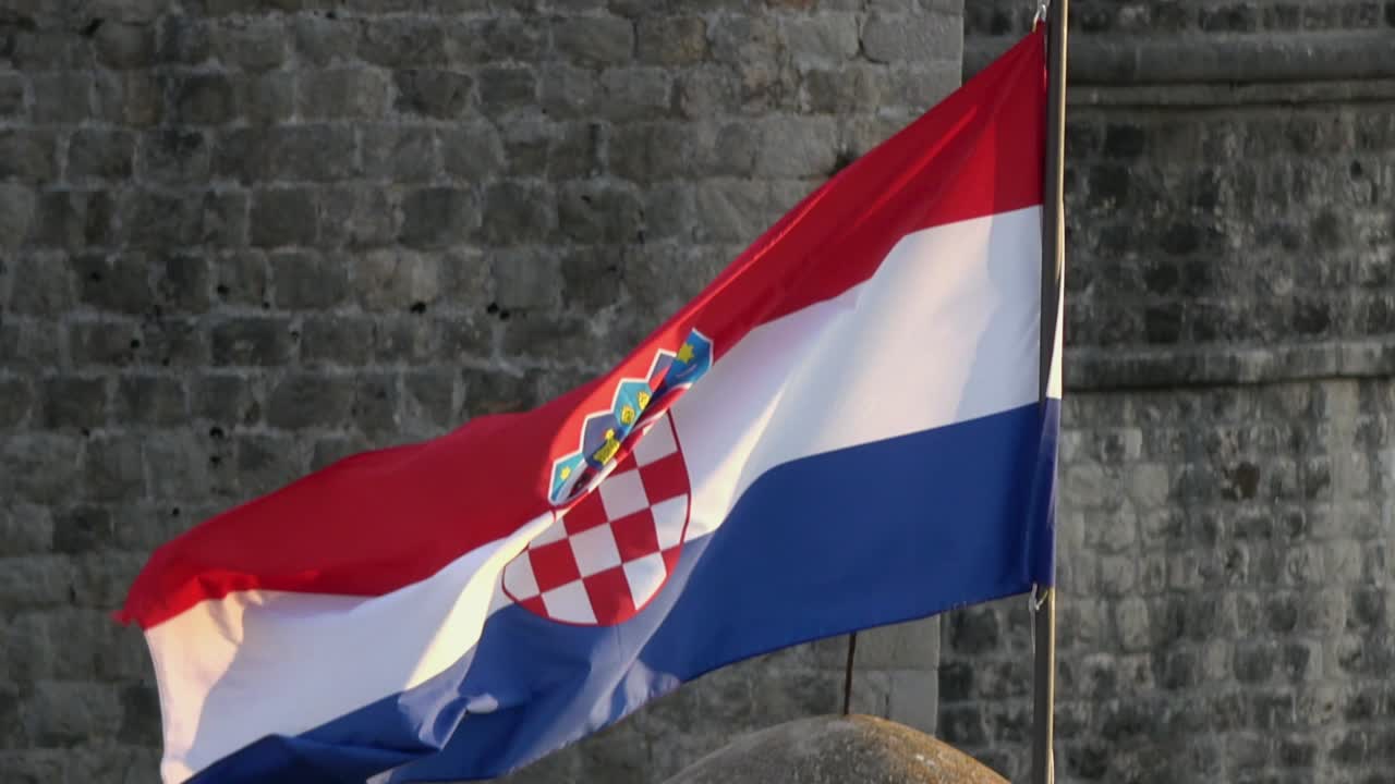 4K. Flag of Croatia waving in the wind on the walls of Dubrovnik