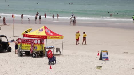 lifeguards and beachgoers near a vibrant station