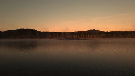 a small island on dune harbor lake in misty weather