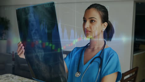 examining x-ray, healthcare professional with financial data animation overlay in office
