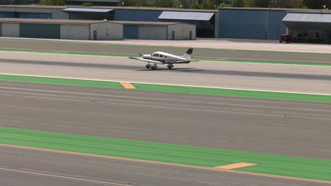 Small-prop-plane-landing-on-runway