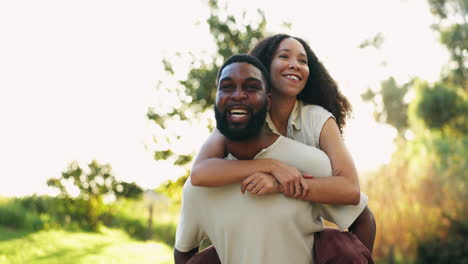 Piggy-back,-happy-and-couple-in-park-for-bonding