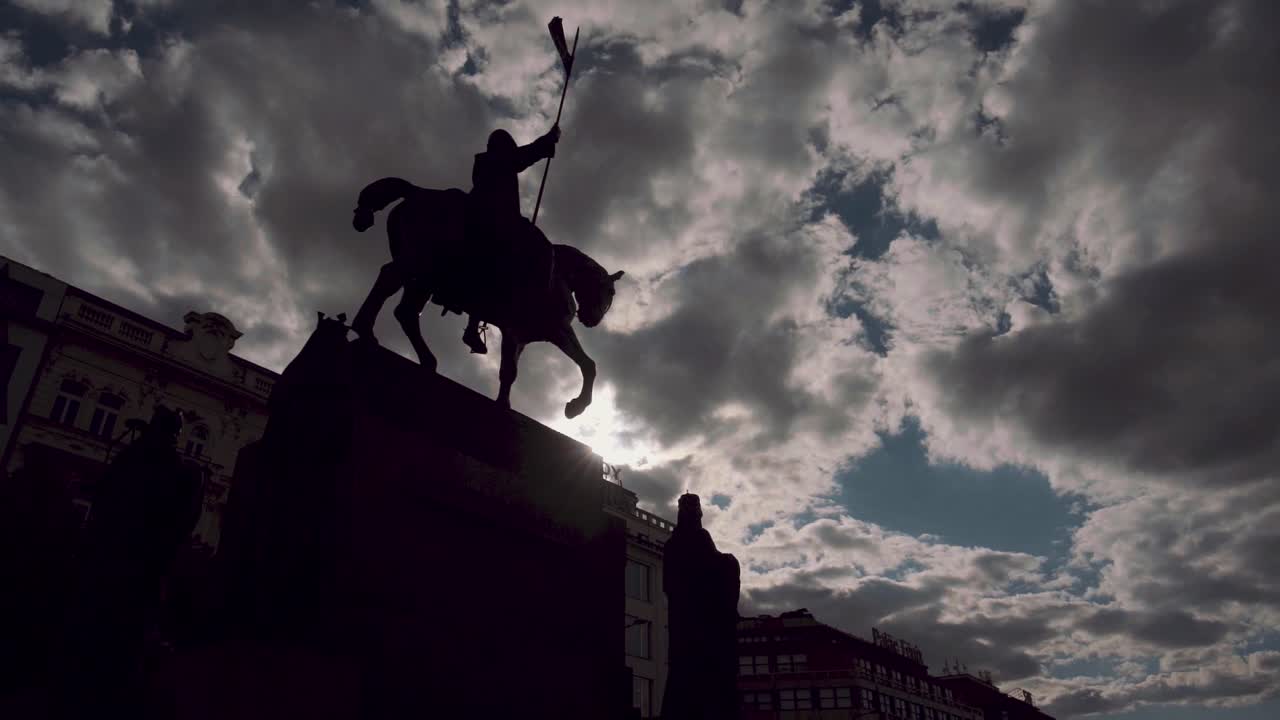 Low angle view of St. Wenceslas statue on square, famous black horse in Prague, Czech Republic