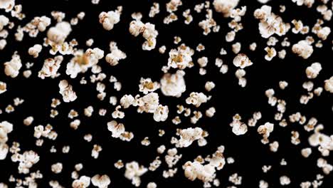 flying many popcorns on black background. white salty popcorn. healthy food. corn seed. 3d loop animation of popcorn rotating.