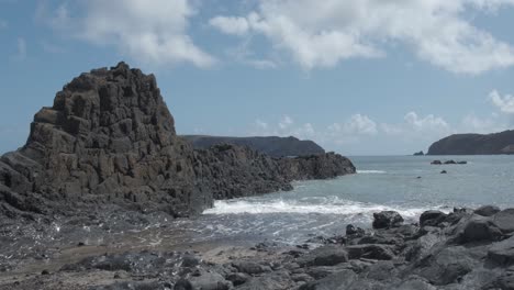 Rocky-formations-on-beach-at-Porto-dos-Frades,-Madeira-in-Portugal